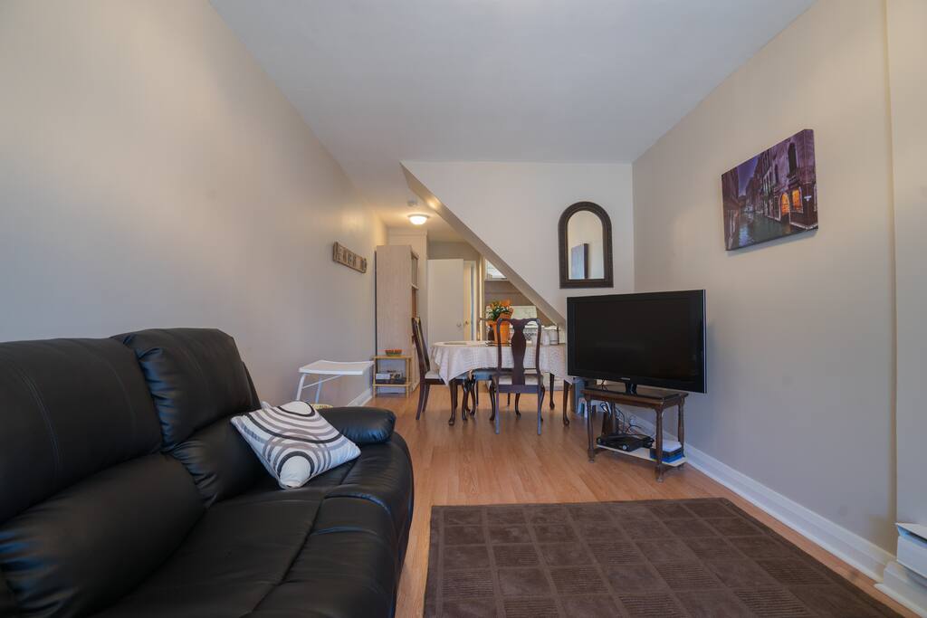 Living room, kitchen in the background