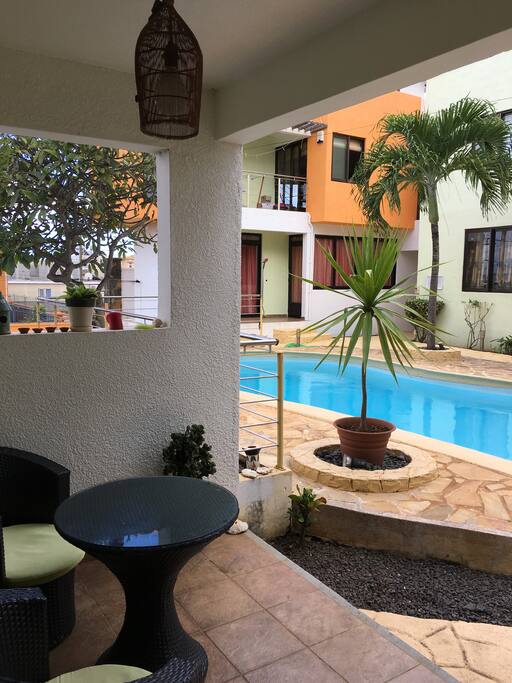 Ground floor balcony in front of the pool