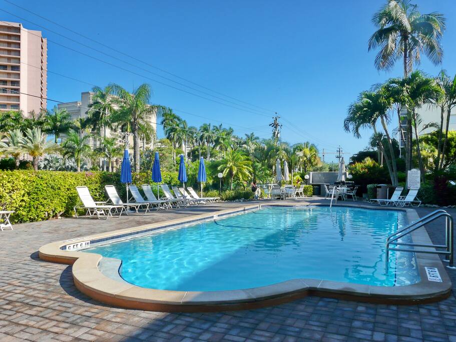 pool with several grills and and large patio