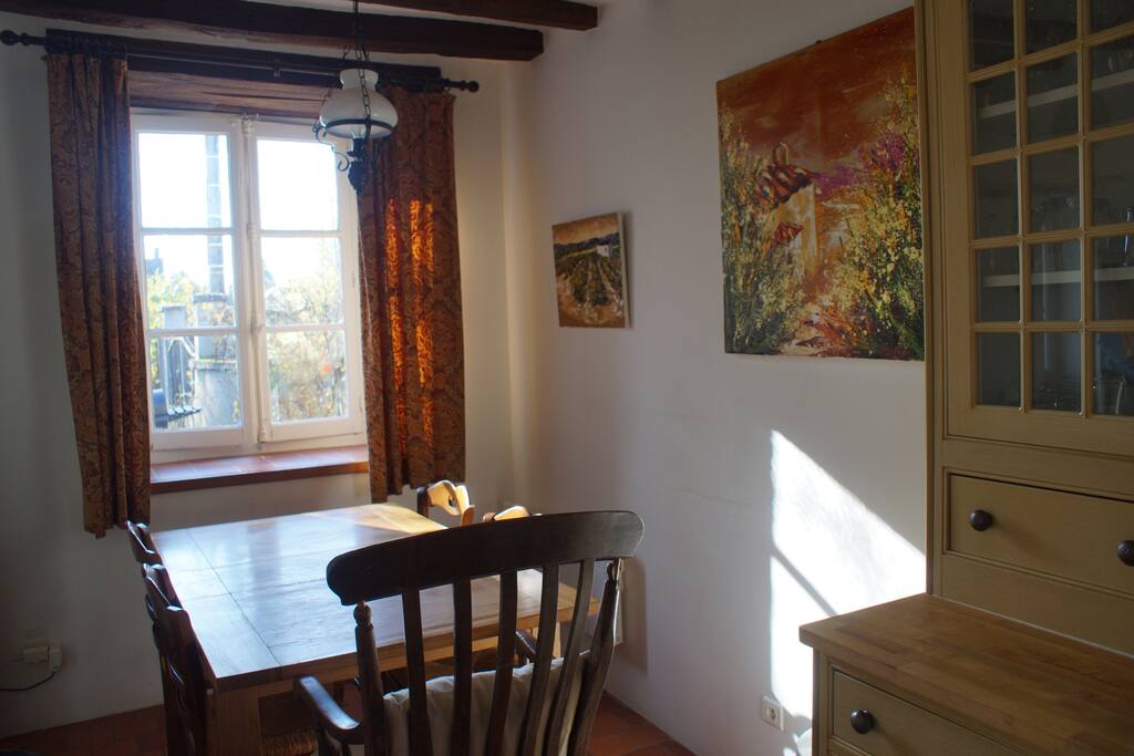 Kitchen dining table and well equipped glass cabinet, all crockery and silver as required