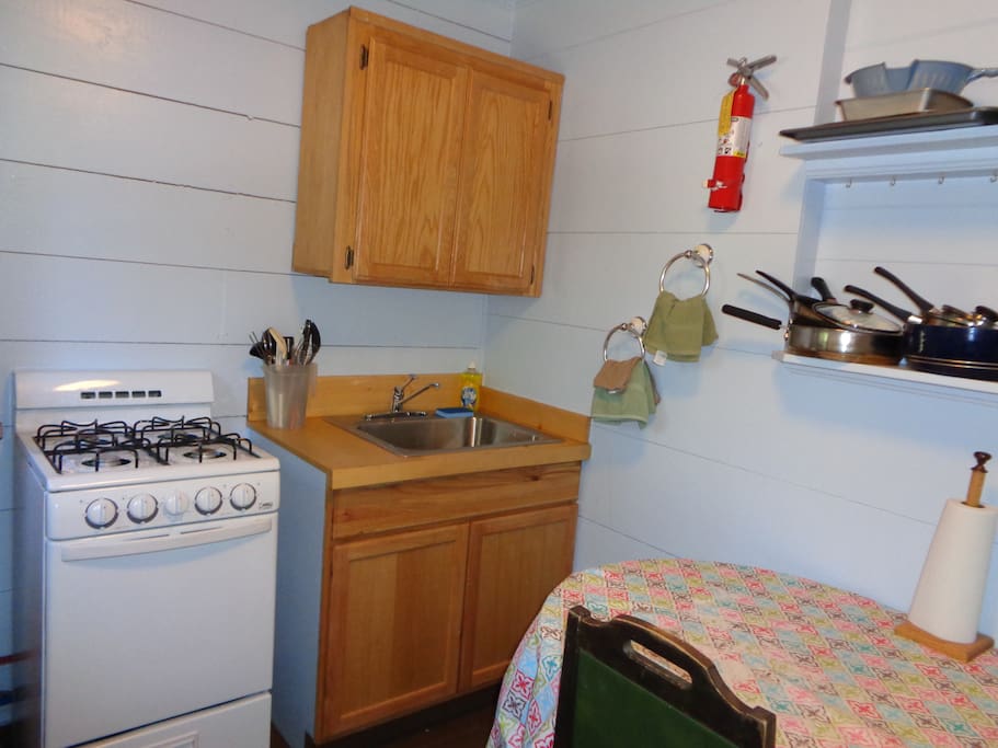 The kitchen has a gas range, full-size refrigerator, table for two and all of the cooking and dining utensils.