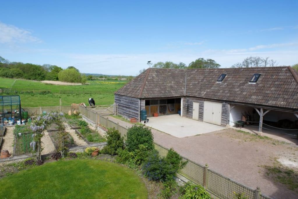 This photo is a little old and the outbuildings on the right now contain a home gym and yoga studio. New photos will be added shortly.