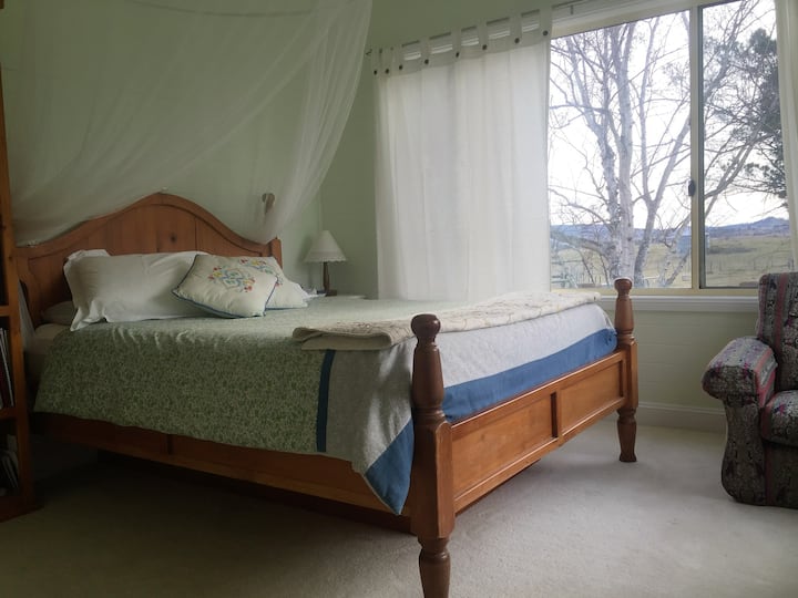 Queen bedroom with garden views