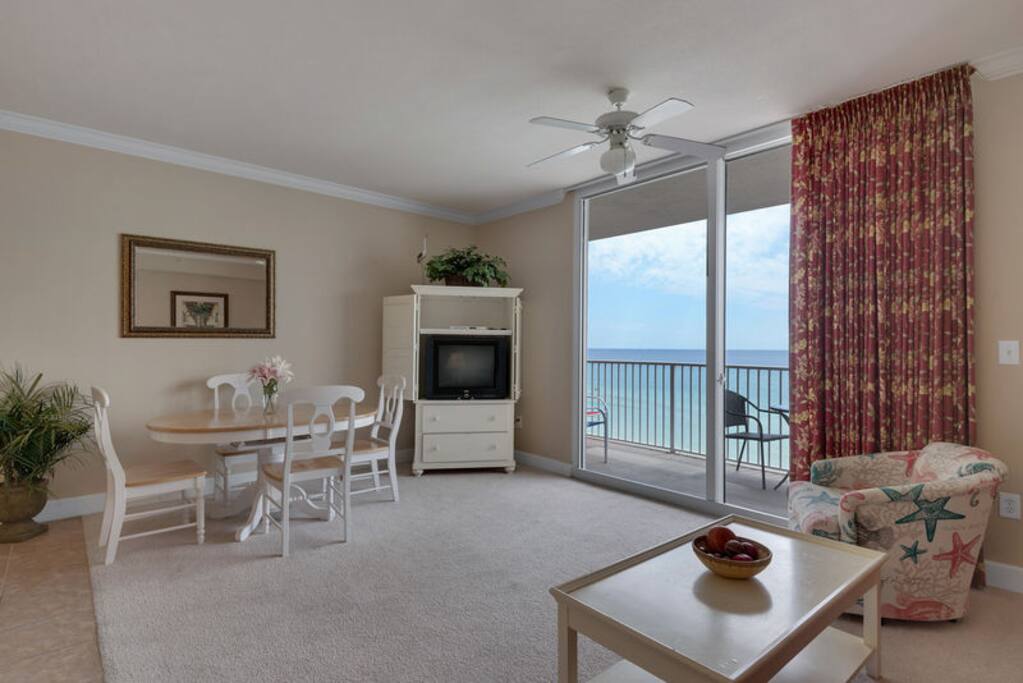 Flat screen TV for your viewing pleasure and dining table seating for 4