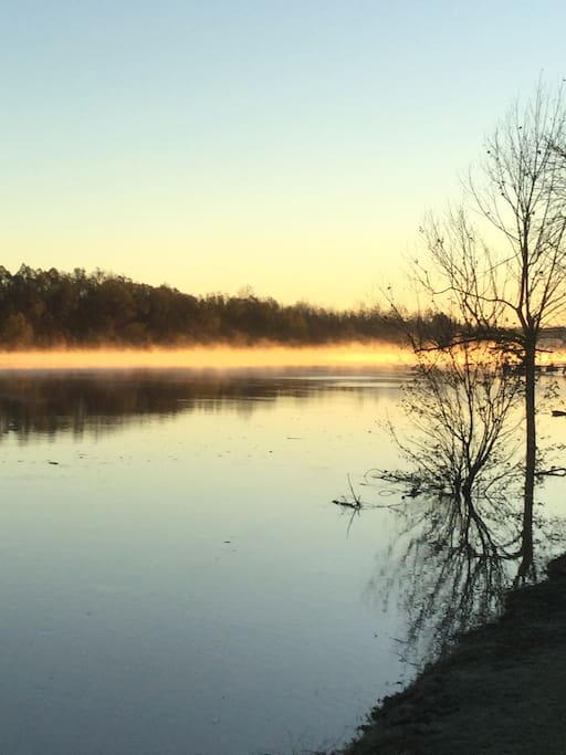Front view, morning sunrise with mists rising on the river.