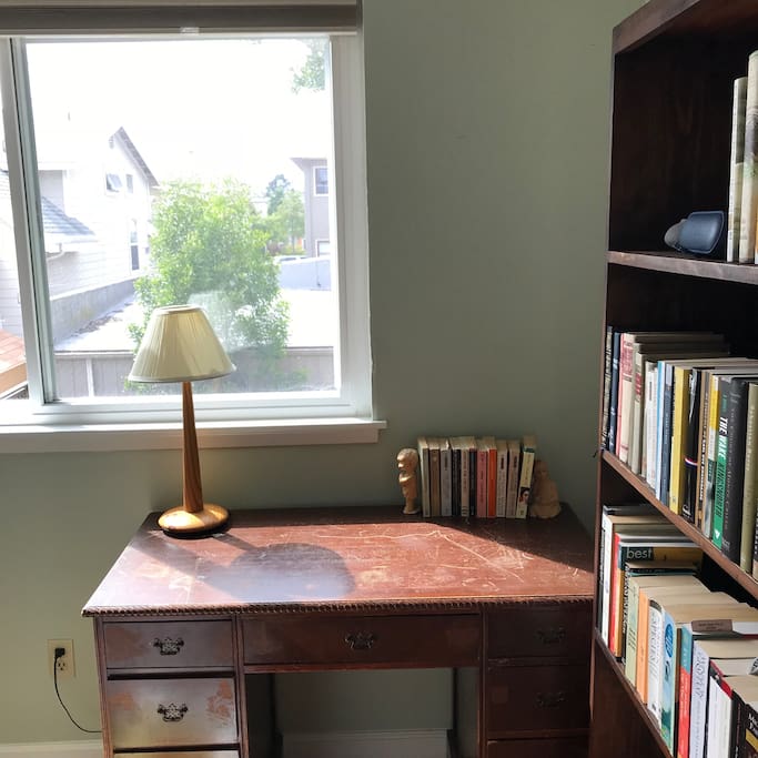 A writing desk with a pleasant view of the garden.