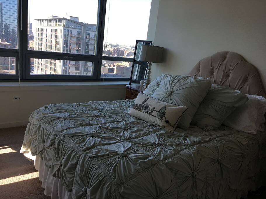 Queen bedroom with East city views