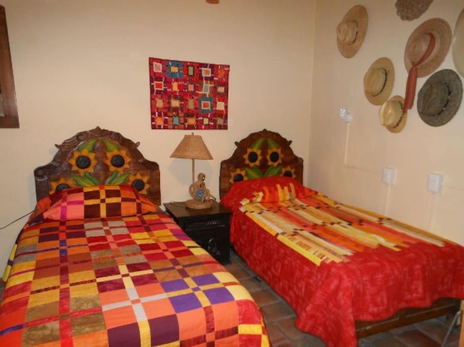 ...One of the bedrooms showing hand made quilts