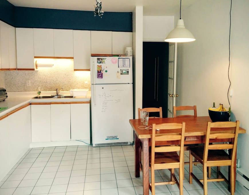 Eat-in kitchen with cupboard and fridge space for guests (standard appliances also shared)