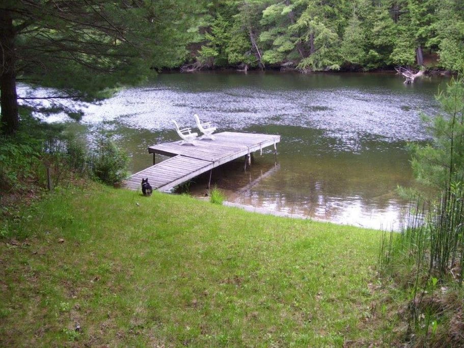 Private dock (recently renovated). Perfect for swimming, sun bathing, fishing, or taking our row boat out for a spin!