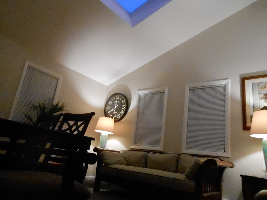 Living room cathedral ceiling with dramatic skylight