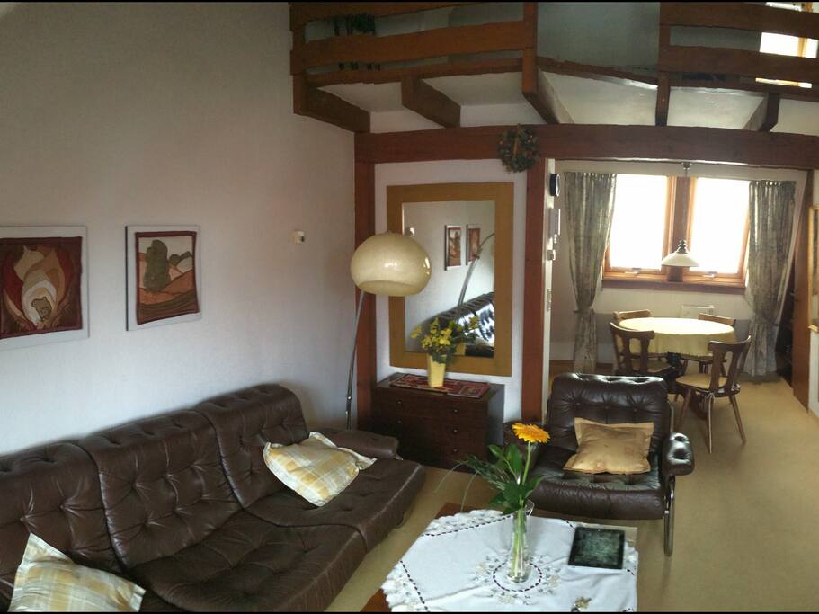 Living room, breakfast nook and kitchenette on left