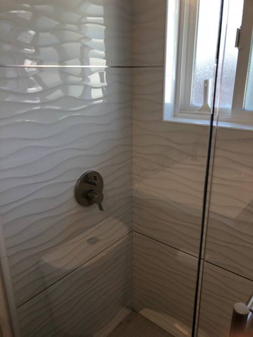 Two clean and brand new bathrooms.