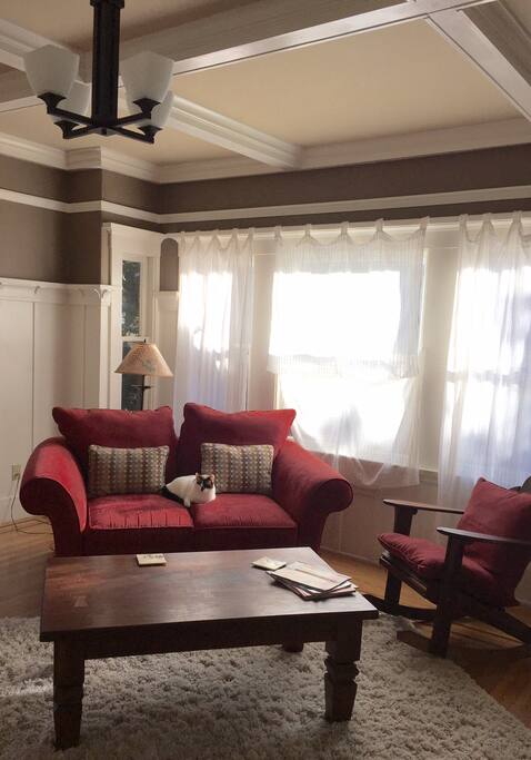 Clean cozy living room with box beams.