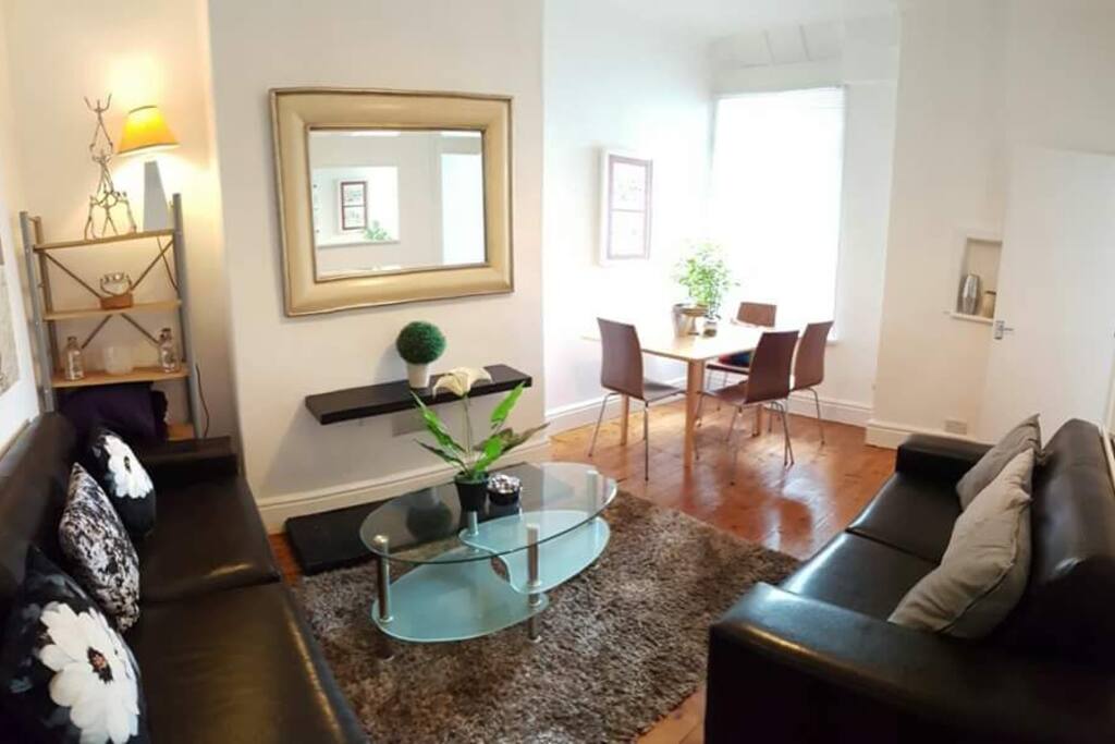 Sitting room with sofas and dining table