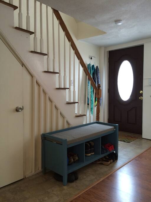 Entrance, and stairway up to second floor. Door to basement.
