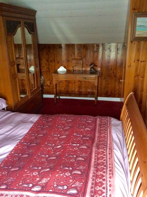 Double bed in the main bedroom. All three bedrooms have a sea view over the bay.