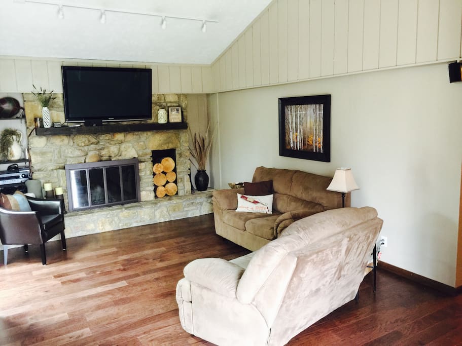 Living Room with fire place adjacent to kitchen