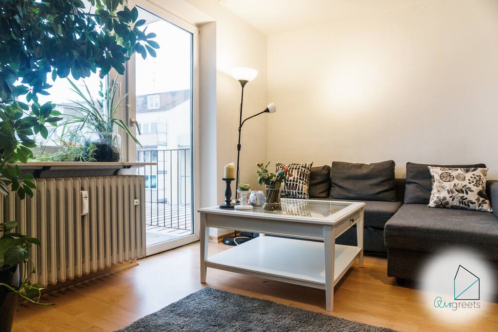 There is a big, comfortable sofa to relax beside the plants.