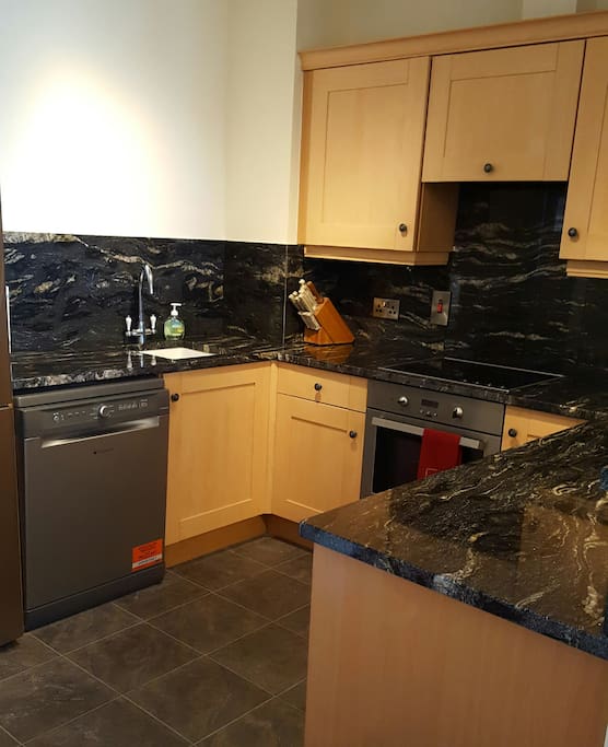 Granite counter top in a well stocked kitchen