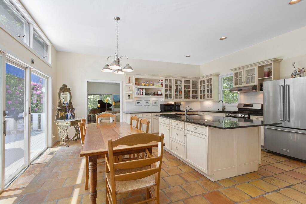 Professional chef's kitchen opens onto dining area that easily seats 8 to 10