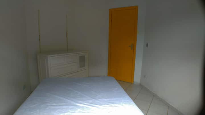 Room 01 has a double bed a dresser, fits another single mattress on the floor .