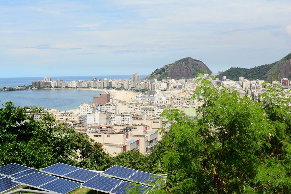 Our green roof with solar panels with Copacabana on the back-ground