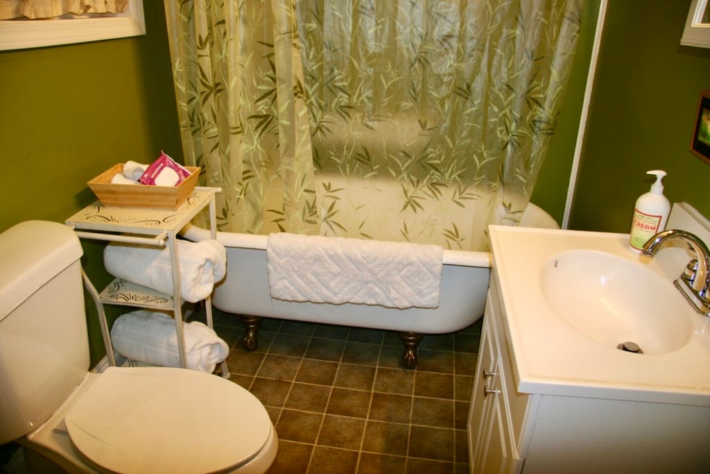 your own bathroom with clawfoot tub, shower and sunlit window