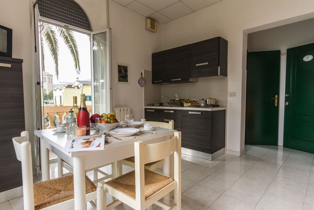 Living room with dining set, well equipped kitchen and sleeping sofa for two