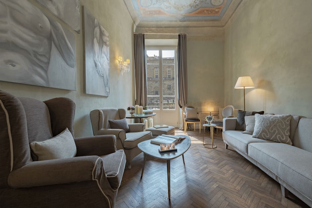 The beautiful living room which offers gorgeous views onto Piazza Pitti.