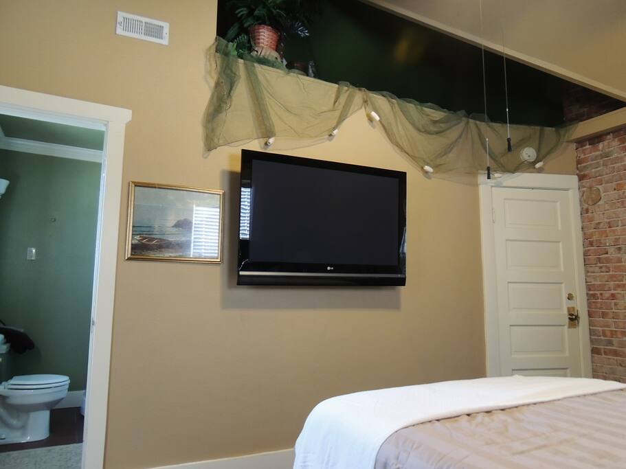 60" plasma at the foot of the bed . . Monday night football never looked so good!
