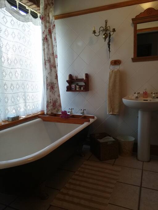 Your private bathroom. My grandma crochet the curtain many moons back and the cast iron claw bath dates back to early 1900.
