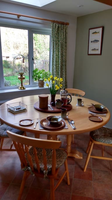 Breakfast in our kitchen where you can enjoy looking onto the garden