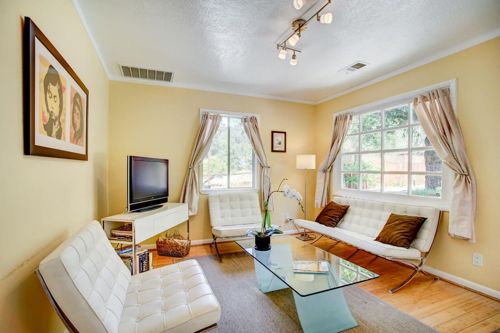 This cheerful living room has plenty of seating as well as a flat-screen TV/DVD for movie-nights in.