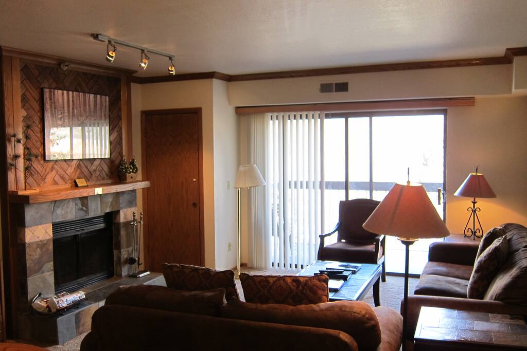 Living room with wood burning fireplace