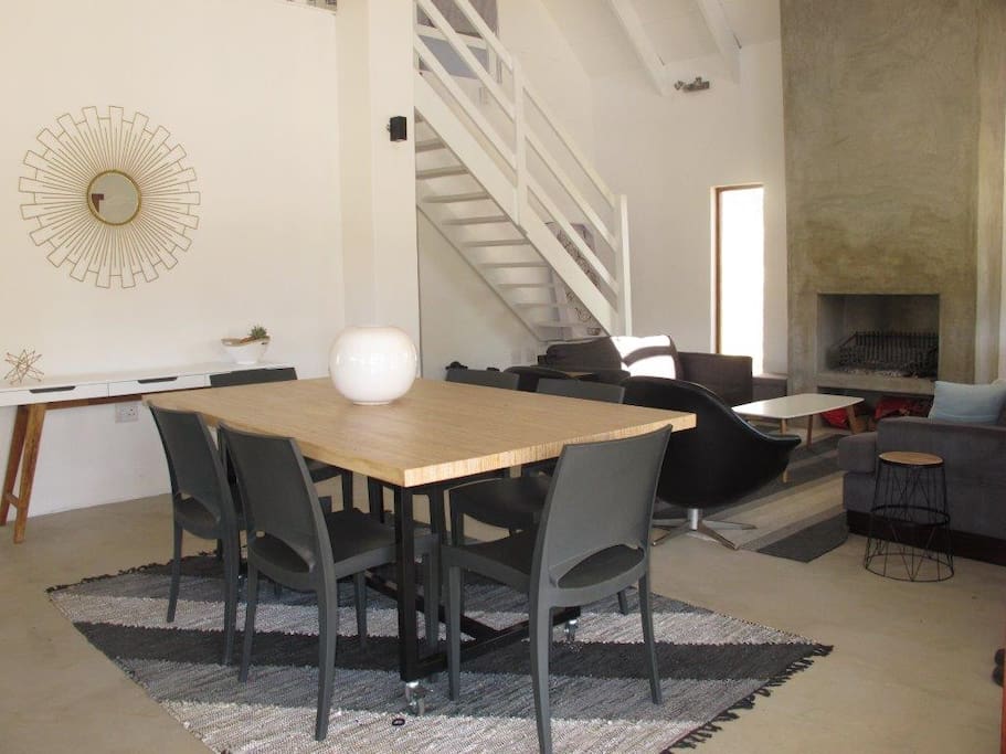 view into the open plan living area indoors - the Tables are on wheels and can be joined to extend the eating space inside or out.
