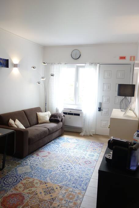 living room with a double sofa-bed and air conditioning