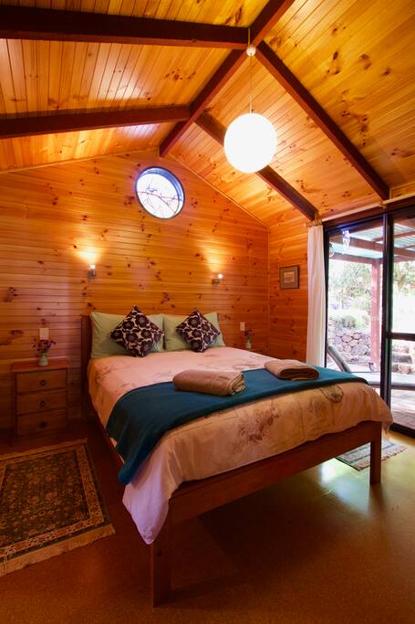 The queen room with sliding door leading to your private outdoor area.