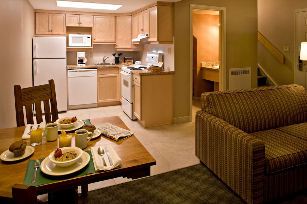 Prepare a delicious meal in the full kitchen with modern amenities, and enjoy your meal at the dining table.