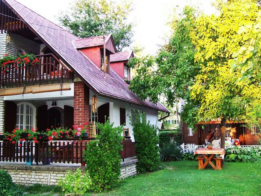 House on the left and Wooden House on the right