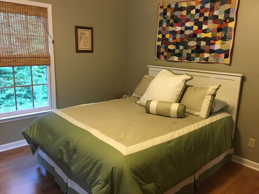 Very comfy queen bed with side table.