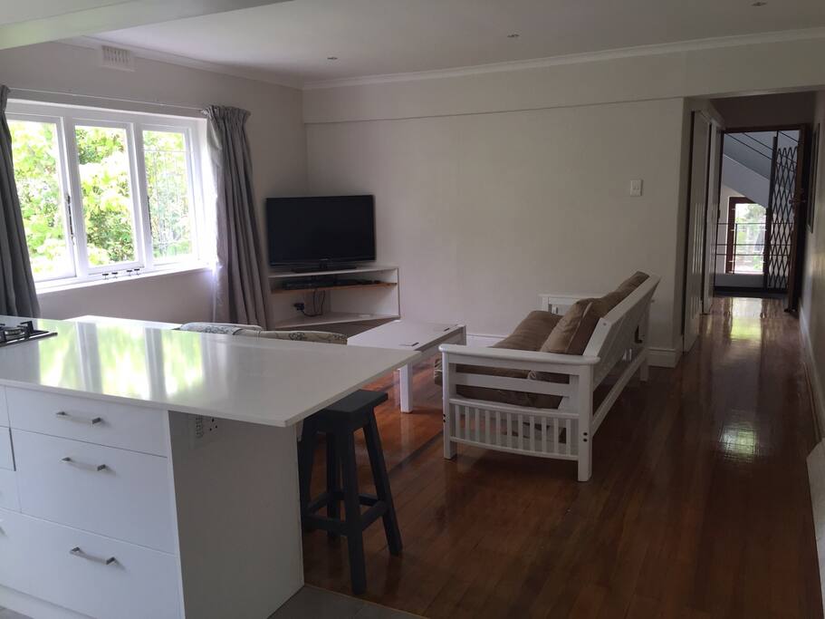 Lounge with 42 inch flat screen TV, DSTV connection, blue ray DVD player and double sleeper couch