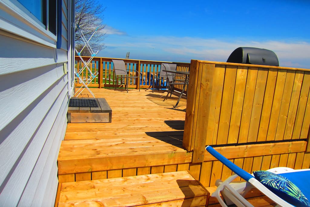 a few steps up to your amazing deck with a fantastic view over West Lake