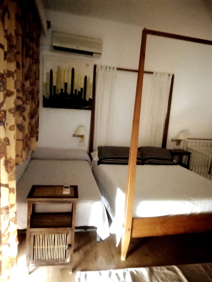 Family room with double bed , single bed and crib