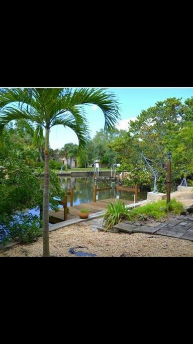 Back patio on canal with dock