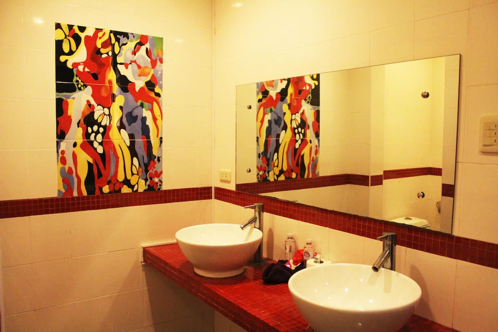 en suite bathrooms with modern artworks