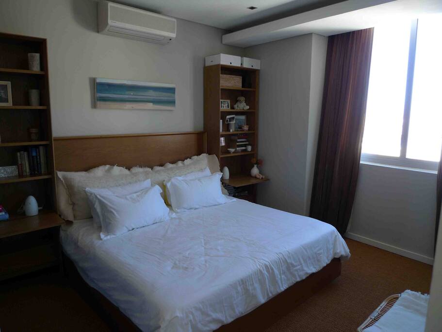 The bedroom with a KING size bed and cupboards