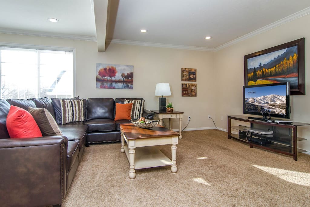 Spacious living room with a TV