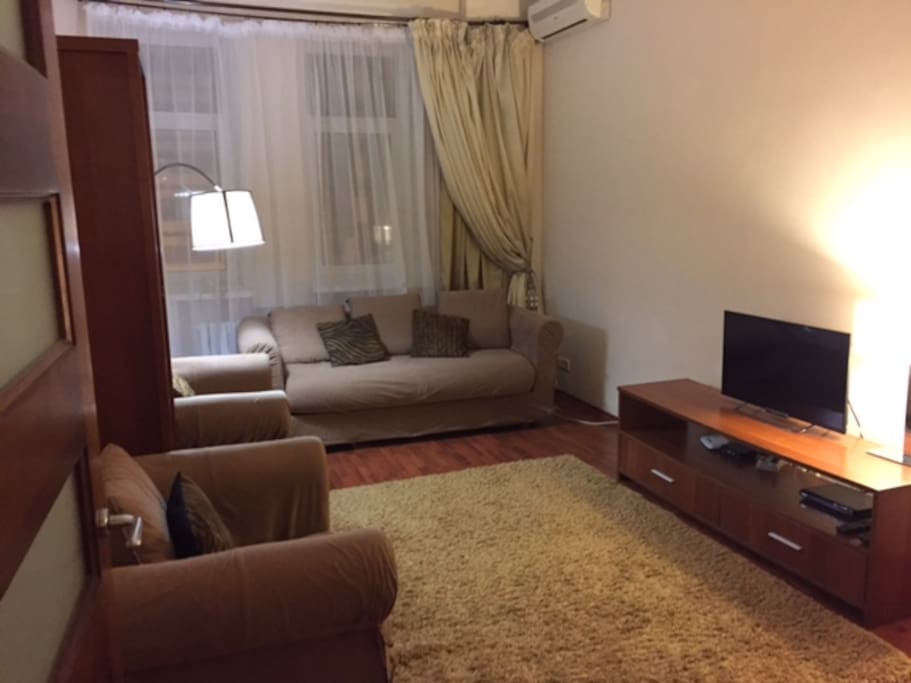 Leaving room with 2 arm chairs , sofa bed with queen size quality mattress