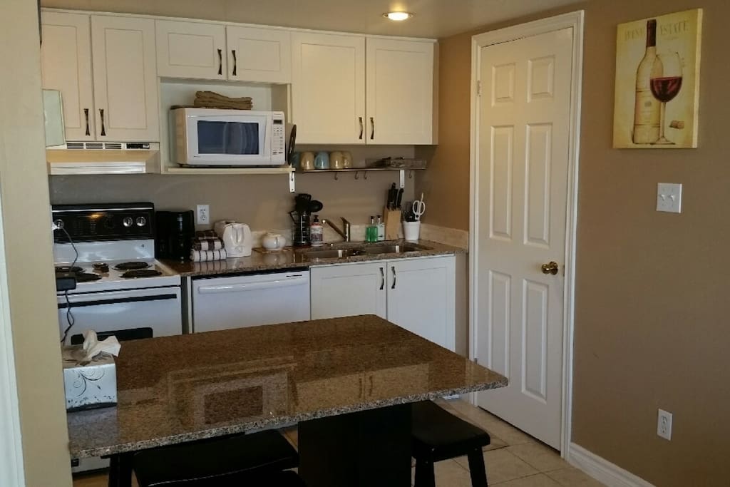Kitchen with granite countertops and island